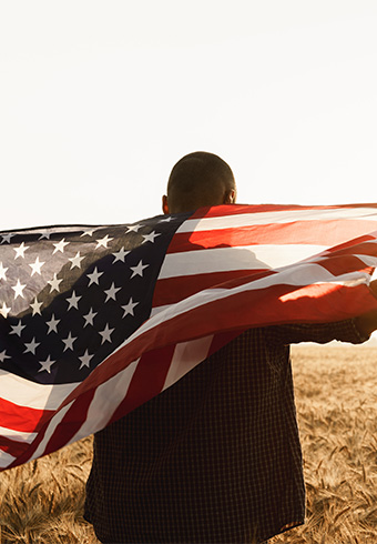 Man holding United States of America flag